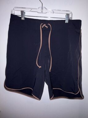 Shop Tan LinesBlack Men’s Swim Shorts with Tan Trim